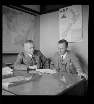 Portrait of (L to R) H Turner and J Turner of Turner and Growers Ltd within an unknown office, Auckland