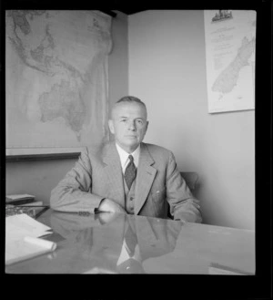 Portrait of H Turner of Turner and Growers Ltd within an unknown office, Auckland