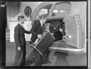 Unidentified men loading luggage into bus, TEA (Tasman Empire Airways), Auckland