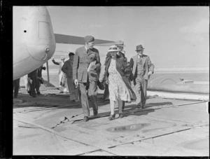 Flight Lieutenant Wilson and other unidentified passengers disembarking an RNZAF Sunderland Flying Boat, Mechanics Bay, Auckland City