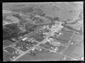 The town of Kaitaia with Commerce Street in foreground and Memorial Park covered in bush on the right, looking south to farmland beyond, Northland Region