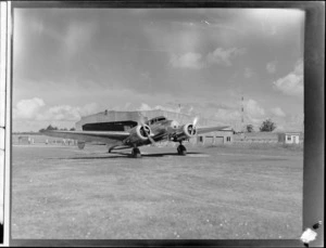 NZNAC Lockheed Electra 'Kaka' twin engine passenger plane in front of Union Airways of NZ hangar, Mangere Airport, Auckland