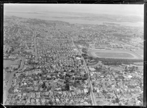 The suburb of Epsom and Manukau Road in foreground with Alexandra Park racecourse, looking north to Auckland City