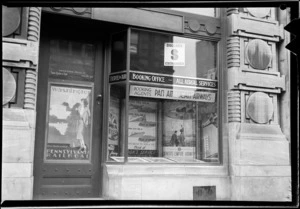 Exterior of Thomas Cook & Son, travel agents, showing booking office window display, Auckland