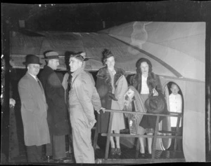 Group of unidentified men and women, [passengers and crew on first Tasman Empire Airways commercial flight from Auckland to Sydney?]