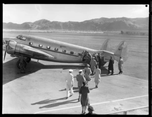 Passengers embarking aircraft, NZNAC (New Zealand National Air Corporation), Rongotai, Wellington