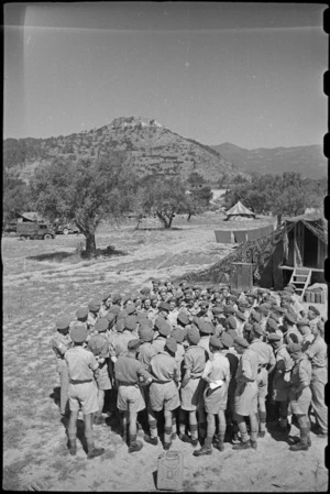Prime Minister Peter Fraser with New Zealanders at Divisional Ordnance Field Park, Volturno Valley, Italy, World War II - Photograph taken by George Bull
