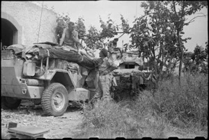 New Zealand armoured vehicles in cover beside road near enemy in next village of Vicalvi, Italy, World War II - Photograph taken by George Bull