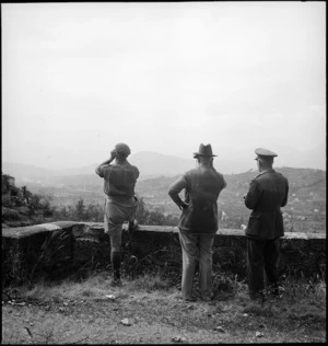 Prime Minister Peter Fraser watching enemy shells landing near Atina, Italy, World War II - Photograph taken by M D Elias