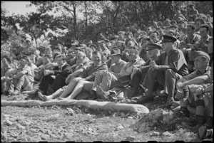 Prime Minister Peter Fraser enjoying performance by the Kiwi Concert Party near Cassino, Italy, World War II - Photograph taken by George Bull