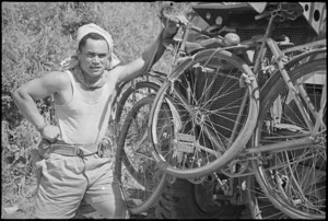 A King, member of NZ Maori Battalion, with pushbikes transported on the Italian Front, World War II - Photograph taken by George Kaye