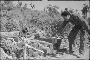 Abandoned enemy ammunition on roadside after the capture of Atina and Belmonte, Italy, World War II - Photograph taken by George Kaye