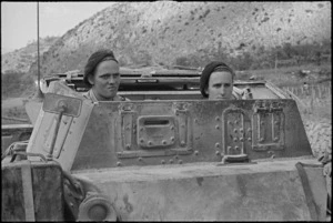 S W Dickie and A K Gellatly follow up the retreating enemy in an armoured vehicle, Italy, World War II - Photograph taken by George Kaye