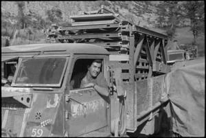 Heavily loaded New Zealand Engineer's truck moves forward as the Germans retreat on Italian Front, World War II - Photograph taken by George Kaye