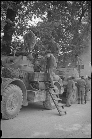 Prime Minister Peter Fraser mounts a Staghound armoured vehicle on the Italian Front, World War II - Photograph taken by George Bull