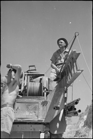 Linesmen, D Reynolds and J Bond, laying out signal wires as NZ Division advances in Italy, World War II - Photograph taken by George Kaye
