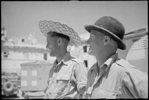 New Zealanders K N Carson and 'Sneezy' Williams wear abandoned headgear in Atina, Italy, World War II - Photograph taken by George Kaye