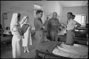 Prime Minister Peter Fraser talking with staff at 2 New Zealand General Hospital, Caserta, Italy, World War II - Photograph taken by George Kaye