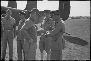 Prime Minister Peter Fraser with military personnel at Bari Airport, Italy, World War II - Photograph taken by George Bull