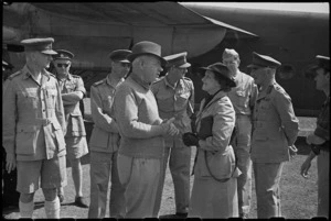 Prime Minister Peter Fraser with Lady Freyberg and senior officers at Bari Airport, Italy, World War II - Photograph taken by George Bull