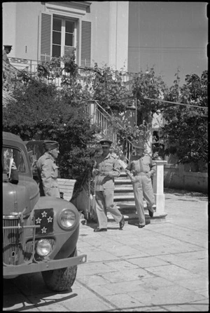 Brigadier Kenrick and Prime Minister Peter Fraser leaving 2 NZEF Officers' Mess at Santo Spirito, Italy, World War II - Photograph taken by George Bull