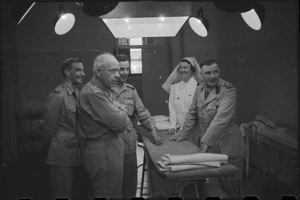 Prime Minister Peter Fraser inspects operating theatre at 1 New Zealand General Hospital, Molfetta, Italy, World War II - Photograph taken by George Bull