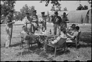 Prime Minister Peter Fraser taking afternoon tea at the NZ Advance Base in Italy, World War II - Photograph taken by George Bull