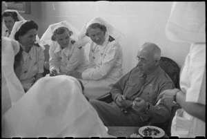 Prime Minister Peter Fraser talking in the Sisters' Mess at 3 NZ General Hospital, Bari, Italy, World War II - Photograph taken by George Bull
