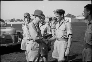 Prime Minister Peter Fraser taking leave of NZ provost who escorted him on his tour of troops in Italy, World War II - Photograph taken by George Bull
