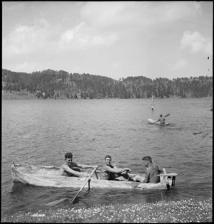 Members of NZ Forestry Unit on lake in canoes carved out of logs, southern Italy, World War II - Photograph taken by M D Elias