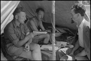 W G Stokes and H H Hyrons, Field Security, interrogate an Italian civilian about enemy movements, World War II - Photograph taken by George Kaye