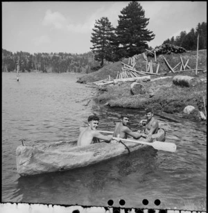 Members of NZ Forestry Unit on lake in canoe carved out of log, southern Italy, World War II - Photograph taken by M D Elias