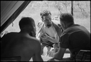 Field Security personnel interrogate an Italian civilian about enemy movements, World War II - Photograph taken by George Kaye