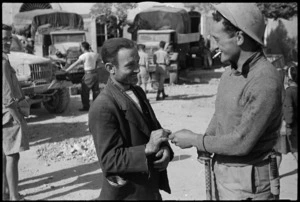 J W Southbridge makes friends with Italian civilian in the town of Atina, Italy, World War II - Photograph taken by George Kaye