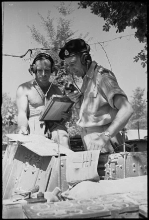 W J Tipler and Lieutenant S A Morris communicating from an armoured vehicle near Sora, Italy, World War II - Photograph taken by George Kaye