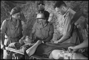 Operation carried out on wounded soldier at 5 NZ Field Advanced Dressing Station near Vicalvi, Italy, World War II - Photograph taken by George Kaye