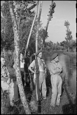 New Zealand soldiers standing on the banks of the Fibrino [Fibreno] River in Italy during World War II - Photograph taken by George Kaye