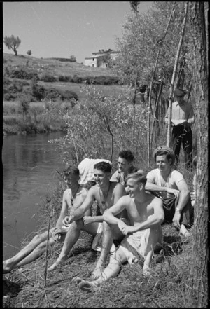 New Zealanders enjoying sunshine on the banks of the Fibrino River in Italy during World War II - Photograph taken by George Kaye