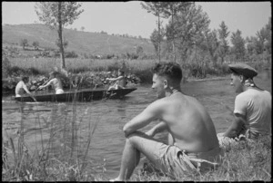 J Mahon and J Elliott watching boating on the Fibrino River in Italy, World War II - Photograph taken by George Kaye
