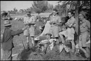 New Zealand Artillery personnel listening to an elderly Italian civilian in the Sora area, World War II - Photograph taken by George Kaye