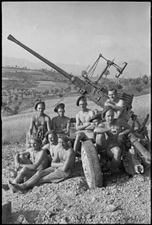 New Zealand anti aircraft gunners rest beside their gun in the Sora area, Italy, World War II - Photograph taken by George Kaye