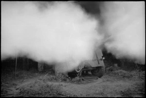 Smoke obscures a New Zealand 25 Pounder firing at night near Sora, Italy, World War II - Photograph taken by George Kaye