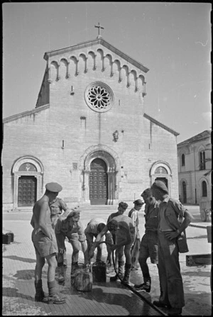 New Zealand soldiers filling water cans in the square at Sora, Italy, World War II - Photograph taken by George Kaye