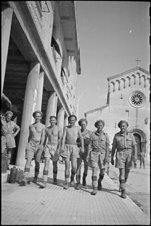 New Zealanders walk along streets of Sora, Italy, shortly after its capture, World War II - Photograph taken by George Kaye