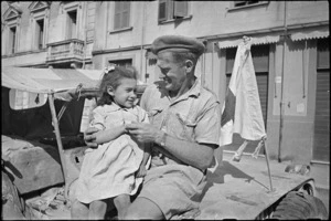 Driver C P Kerrisk with a small refugee he brought to Sora by ambulance jeep, Italy, World War II - Photograph taken by George Kaye