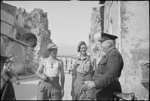 R G Ramsay and J B Douglas-Clifford make conversation with an Italian policeman in Sora, Italy, World War II - Photograph taken by George Kaye
