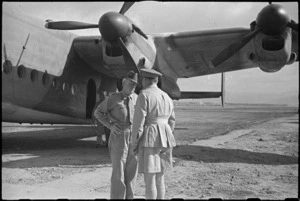 Prime Minister Peter Fraser met by General Freyberg at airfield near Naples, Italy, before visit to Rome, World War II - Photograph taken by George Bull