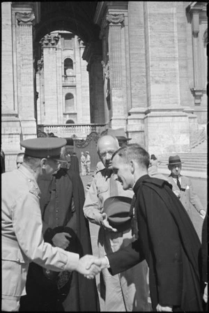 Prime Minister Peter Fraser introducing General Bernard Freyberg to Father John Flanagan in Rome, Italy, World War II - Photograph taken by George Bull