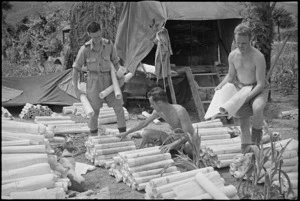 Personnel sorting out maps during 2 NZ Division's rapid advance in Italy, World War II - Photograph taken by George Kaye