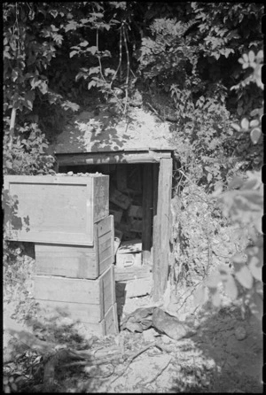 Concealed entrance to German dug-out in town of Orsogna, Italy, World War II - Photograph taken by George Kaye